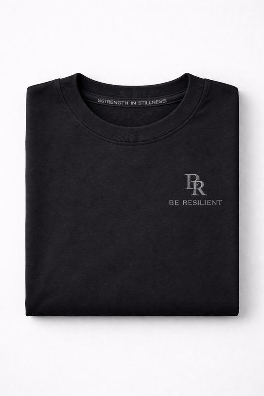 Folded Be Resilient premium black 220 GSM cotton T-shirt featuring the embroidered BR logo.