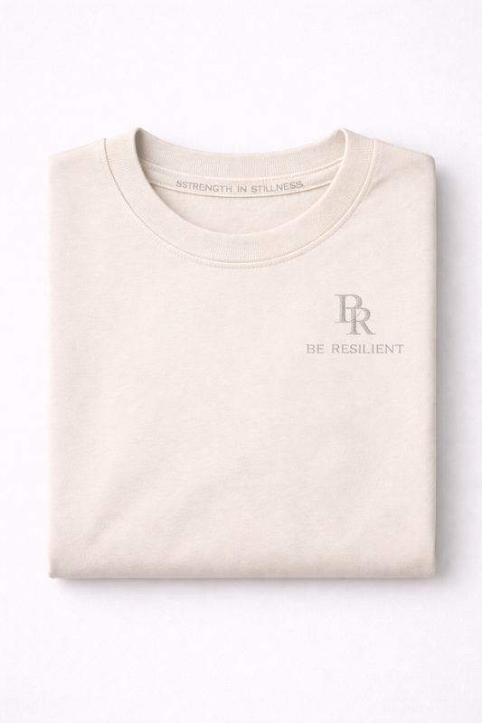 Folded Be Resilient premium starlight 220 GSM cotton T-shirt featuring the embroidered BR logo.