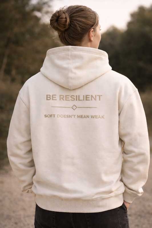 Back view of the Be Resilient premium starlight hoodie featuring the embroidered "Soft Doesn't Mean Weak" affirmation.